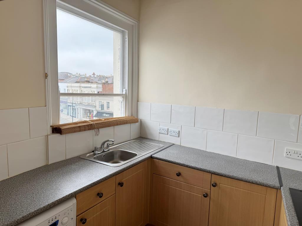 Lot: 160 - TOWN CENTRE FLAT FOR INVESTMENT OR OCCUPATION - The Kitchen and View From the Window